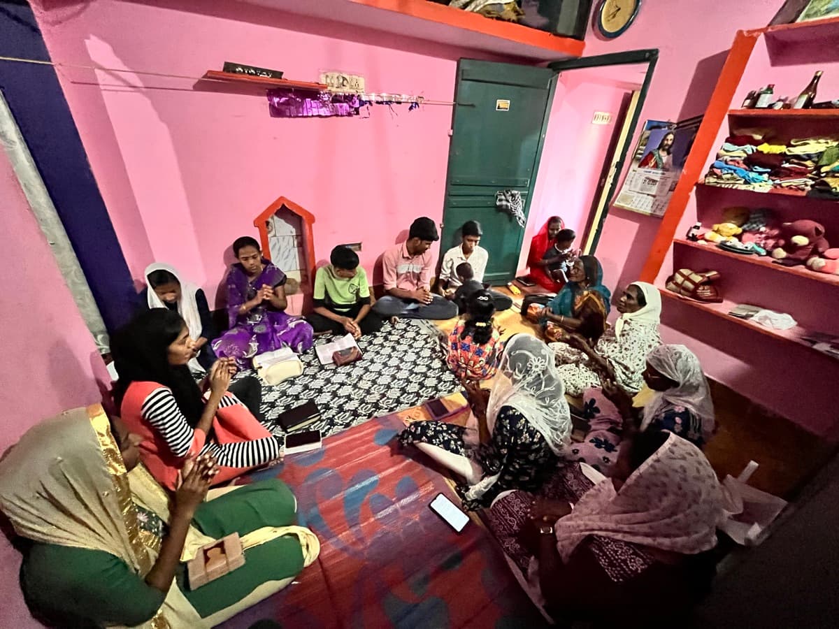 Home prayer group gathered together for worship