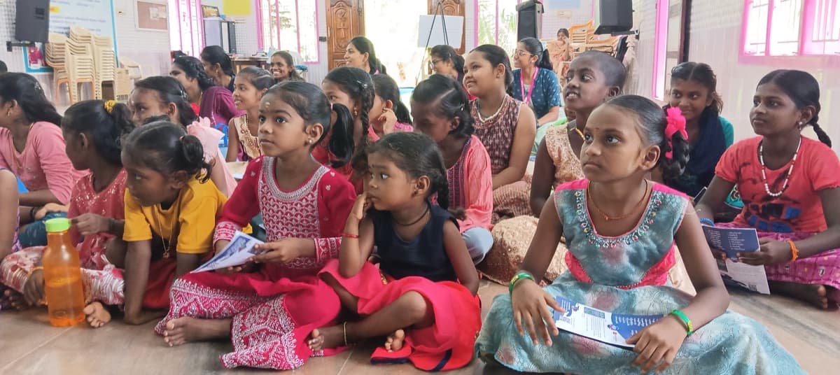 Children sitting attentively in a learning session